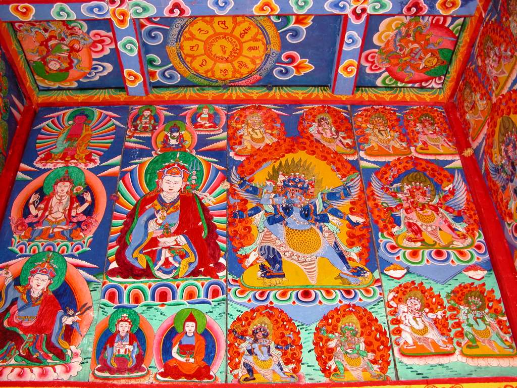 Manaslu 06 08 Syala Kani Painting The paintings on Syala�s kani wall include a 4-armed Avalokiteshvara on the left, then Padmasambhava, a six-armed Mahakala, and red Hayagriva on the right.